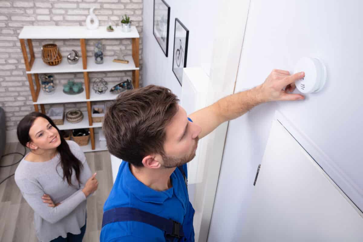 example of an sei security technician installing a carbon monoxide detector